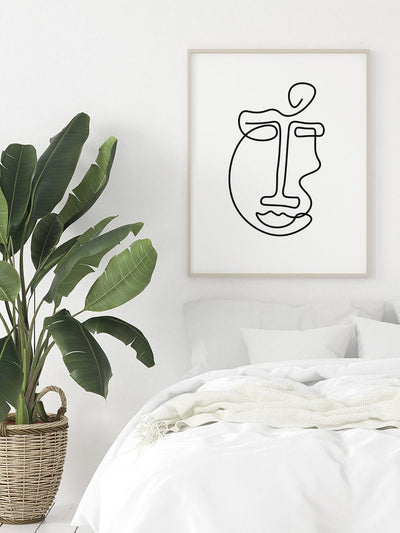 abstract-face-line-art-poster-in-a-bedroom